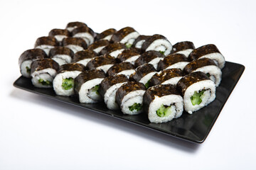 Fresh delicious japanese sushi with avocado on white background.