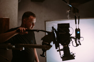 Director of photography with a camera in his hands on the set.