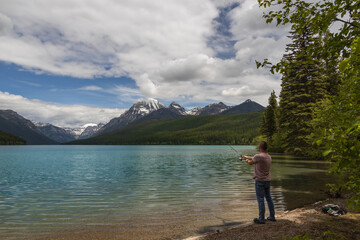 Man fishing at Bowman Lake, Montana 