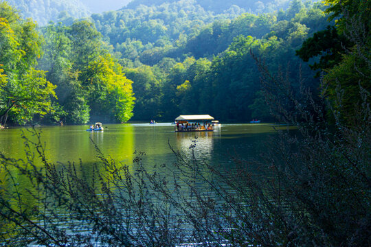 Parz Lich (Clear Lake) in Dilijan, Armenia.tourists traveling by boat.
