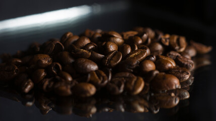 Brown Roasted Coffee Beans Closeup On Dark Background Whith Reflection