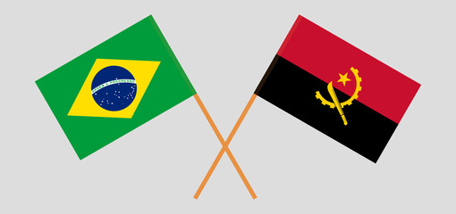 Crossed flags of Brazil and Angola. Official colors. Correct proportion