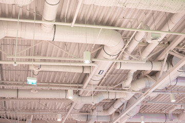 Air duct, wiring and plumbing in the mall. Air conditioner pipe, wiring pipe, and plumbing pipe system.