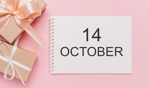 Gifts with note letter on isolated pink background, love and valentine concept with text 14 October