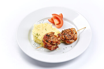 pork kebab with mashed potato and vegetables