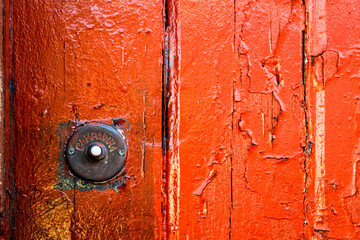 Rusty Doorbell in Old colorful door in Lisbon