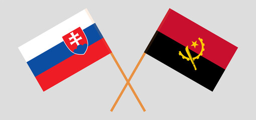 Crossed flags of Slovakia and Angola. Official colors. Correct proportion