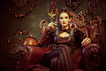 Fototapeta premium woman sits holding cigar