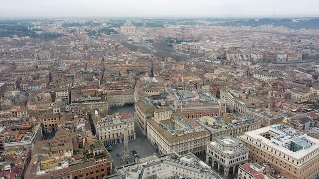 Aerial view of downtown Rome, Italy. City center with government buildings seen from drone flying in sky and Saint Peter's Basilica in Vatican City in background. Italian panoramic urban landscape