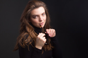 Obraz premium Young brunette woman, with gathered hair hairstyles