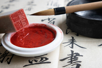 Tools needed for writing Chinese calligraphy, including brush, paper, ink, ink tank, signature seal...