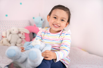 Cute little girl in pink room..