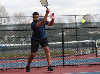 Pickleball fun is taking place at an outdoor facility.