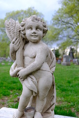 Fototapeta na wymiar statue of angel with flower