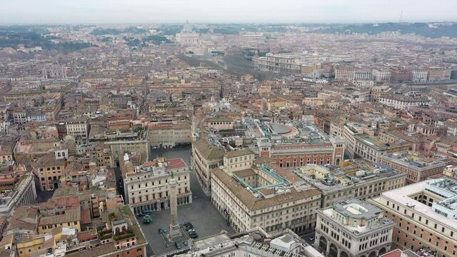 Aerial view of downtown Rome, Italy. City center with government buildings seen from drone flying in sky and Saint Peter's Basilica in Vatican City in background. Italian panoramic urban landscape