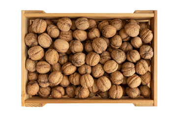 Walnuts in wooden box, top view. Harvest concept