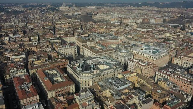 Aerial view of downtown Rome, Italy. City center with government buildings seen from drone flying in sky and Saint Peter's Basilica in Vatican City in background. Italian panoramic urban landscape