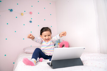 Happy little girl winning a game.