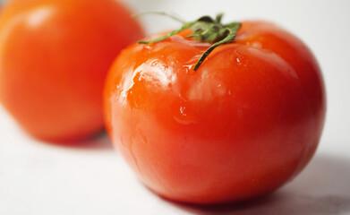 Close up red tomato with drops of water. Fresh vegetables 