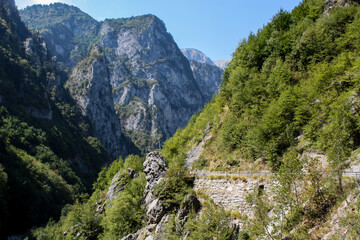 Fototapeta na wymiar Mountains around the Rugova Valley in Kosovo and a road leading through them