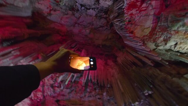 Taking picture inside cave in Gibraltar in 4k slow motion 60fps