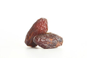 Dates on a white background. Dried fruits. Dried dates lie next to each other