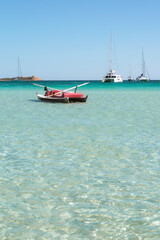 Fototapeta premium Boats and water sports in Cala Brandinchi, Sardinia