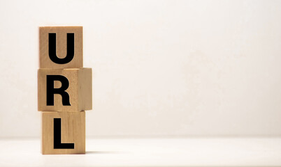 Letters abbreviation url www on wooden cubes, on a dark background.
