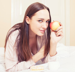 young pretty brunette woman laying in bed, luxury white interior vintage having breakfast cute