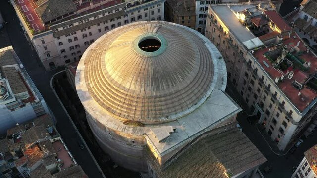 Aerial view of the Pantheon, famous monument in Rome, Italy. Former Roman temple and now Catholich church in Roma, Italia seen from drone flying in sky. Building and tourist attraction of Italian city