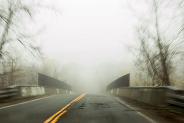 Foggy Road Leading to a Bridge 