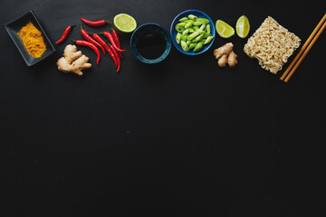 Asian food ingredients on dark background