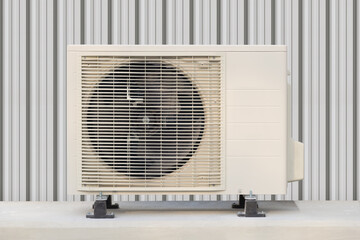 Condenser unit or compressor outside industrial plant building. Unit of central air conditioner...