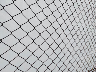 Abstract, background and pattern of link fence wire, metal grid