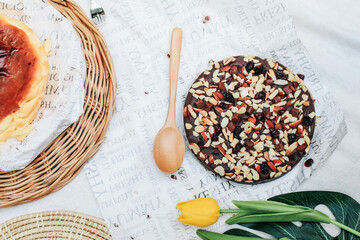 Chocolate brownie topping with almond. Fresh homemade bakery. Served cakes. Top view. Free space for text.