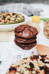 Chocolate brownie cookies. Baked Creamy Dark chocolate chip cookies on dark texture background. Morning table. Copy space.