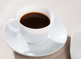 Image of cup of fresh black coffee americano on table, no people