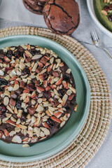 Chocolate brownie topping with almond. Fresh homemade bakery. Served cakes. Top view. Free space for text.
