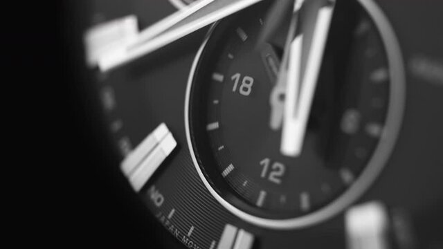 black, modern, chronograph wristwatch close-up