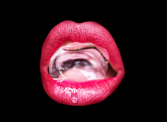 Female mouth with ice cube. Closeup of sexy female lips holding cold fresh crystal ice cube.