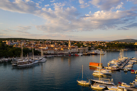 Sunset over the Krk old town and harbor in the Krk island in Croatia in summer