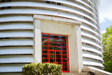 round telescope building with red doors