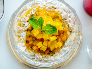 Breakfast muesli with mango in luxury hotel