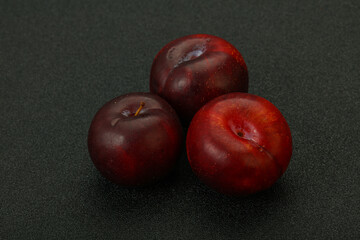 Ripe sweet plum fruit heap
