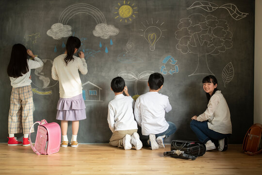 Children Drawing on a Blackboard
