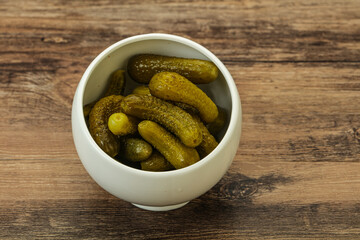 Pickled gherkin in the bowl