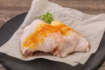 Raw chicken thigh with spices