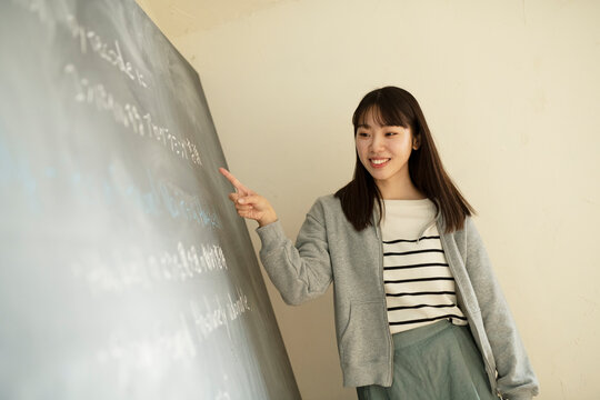 Young Female Teacher at Platform