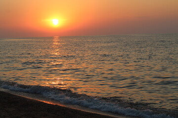 Beautiful sunset above the sea in summer