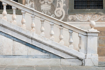 Fototapeta na wymiar Classic white marble railing on the outside of an historic building in Italy